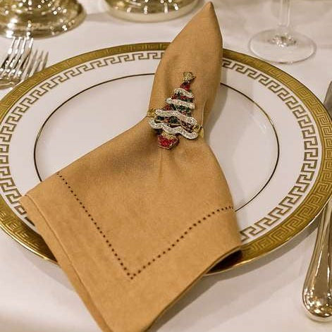 Front view of sparkling gold Christmas tree napkin ring with crystal embellishments.