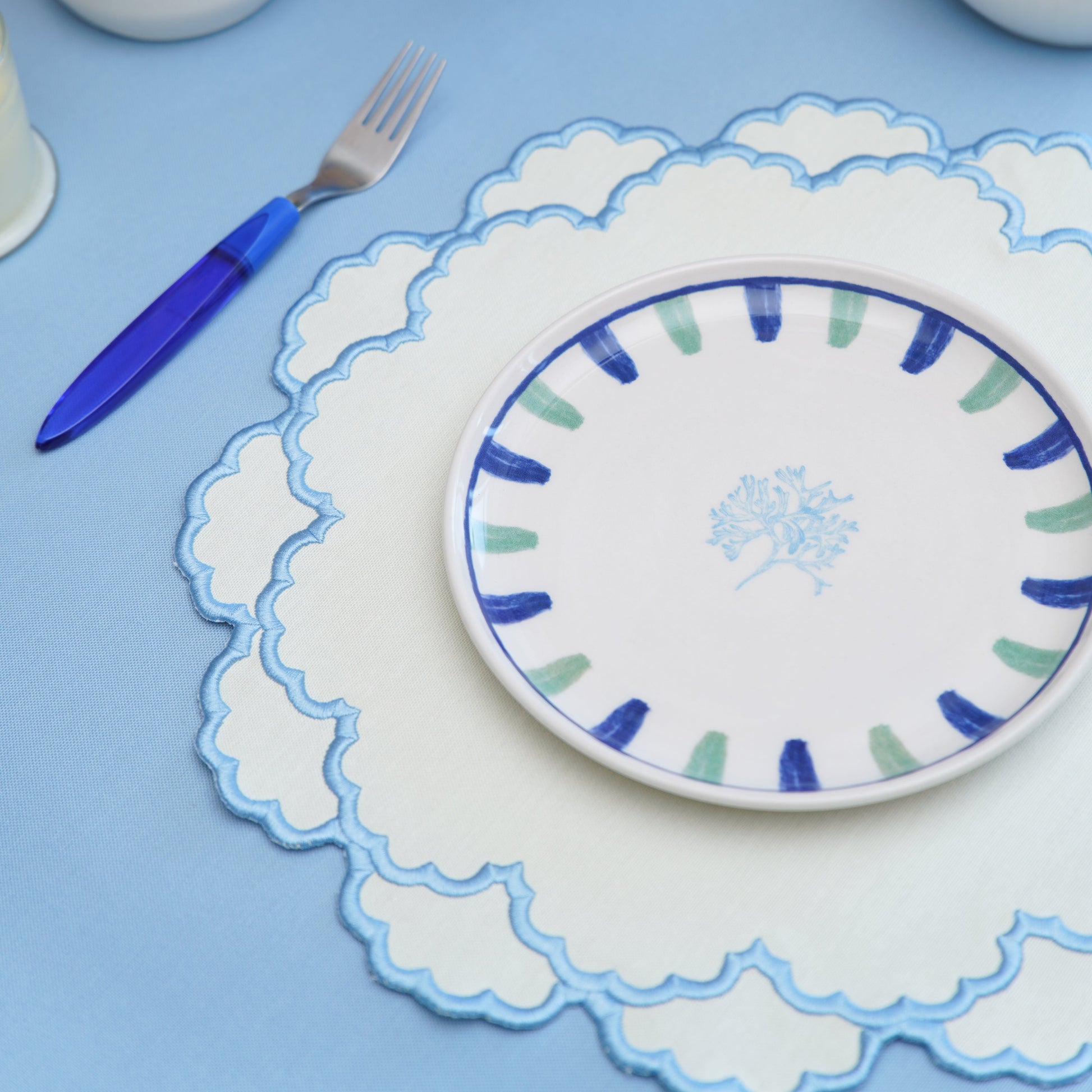 Handmade scalloped-edge placemat perfect for upscale occasions