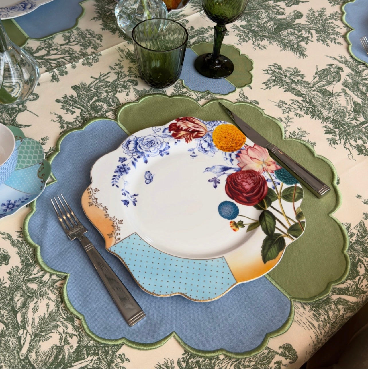 Scalloped fabric placemat displayed in a minimalist table settings