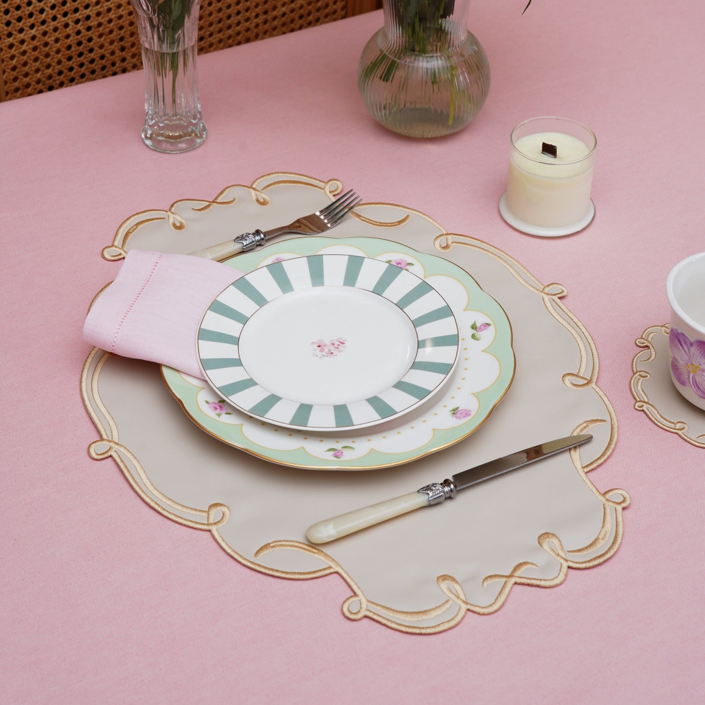 Coordinated oval table mat and drink coaster presented in a stylish scene