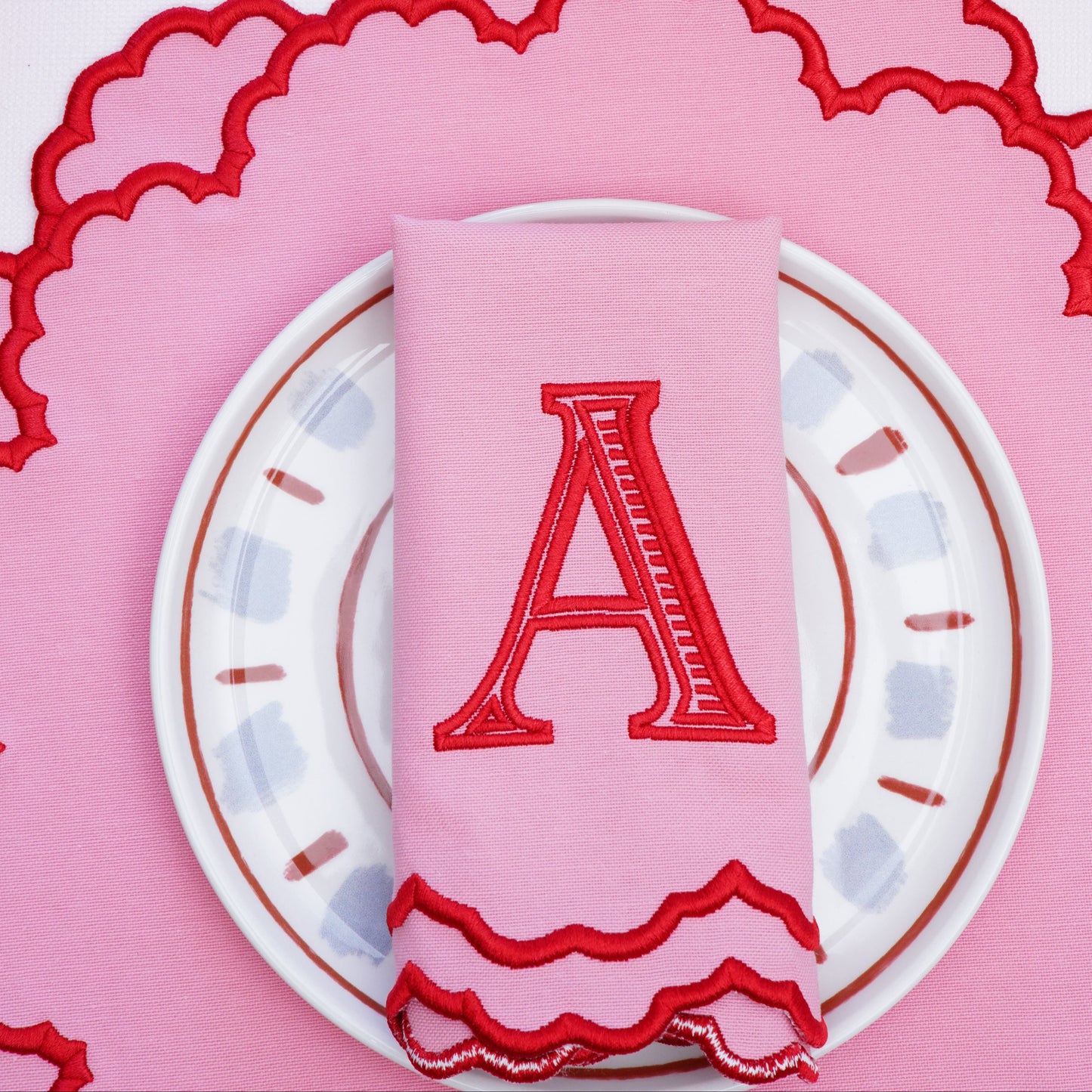 Refined tabletop set including matching napkin and placemat with ornate design