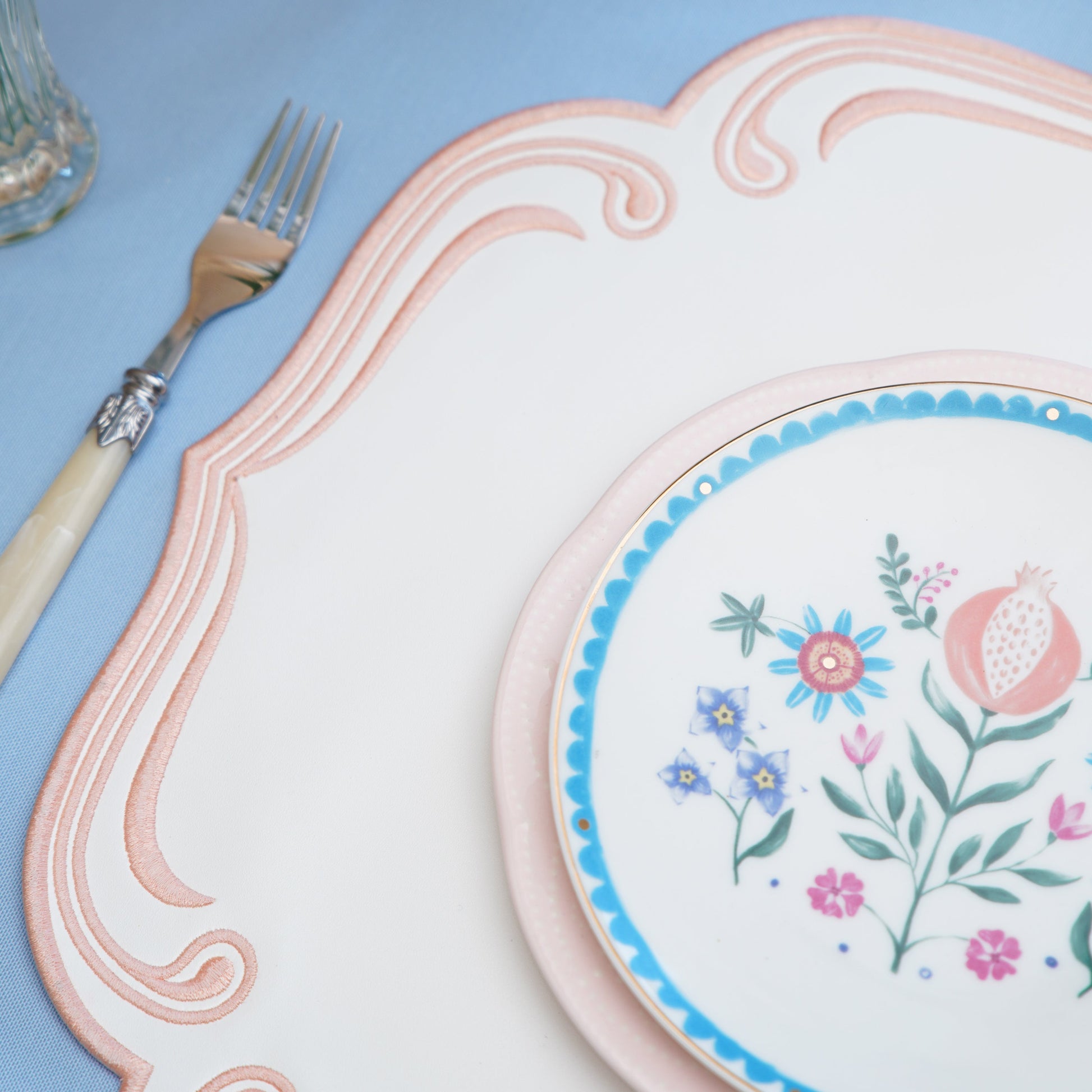 Luxurious dining table setup featuring a handcrafted square placemat