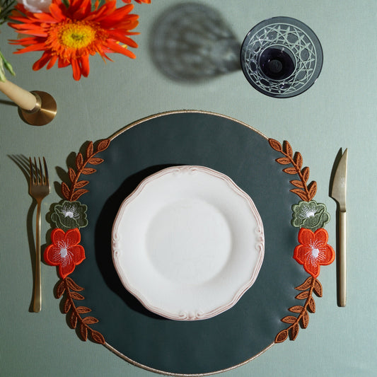 Embroidered faux leather placemat styled for a special occasion dinner table