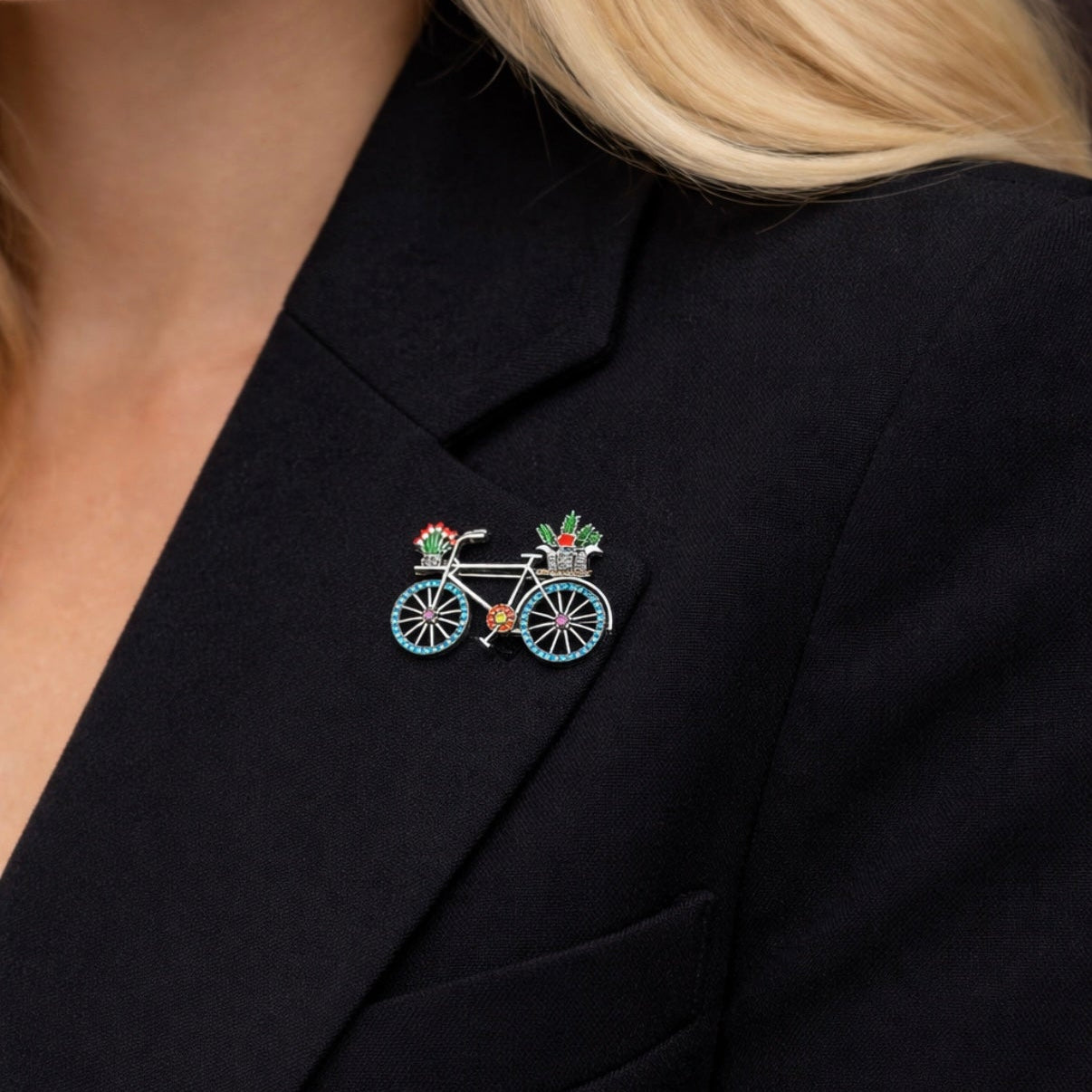 Close up of whimsical silver tone bicycle brooch with blue crystal wheels and flower baskets by PNR Decor ship from USA