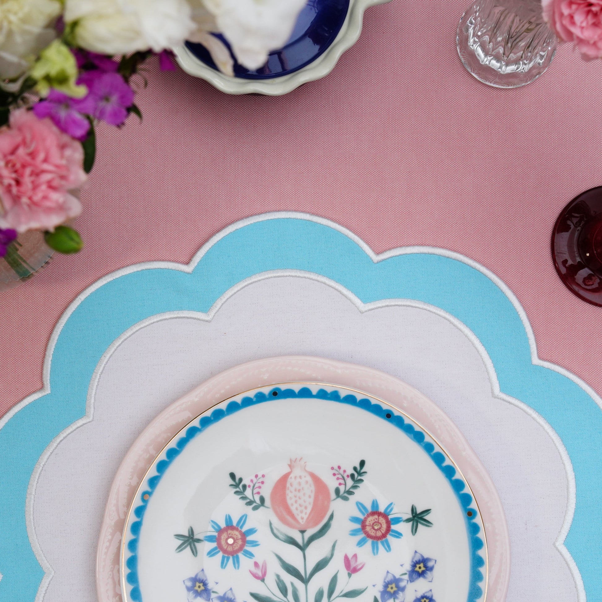 Close-up of delicate stitching on handcrafted scalloped placemat