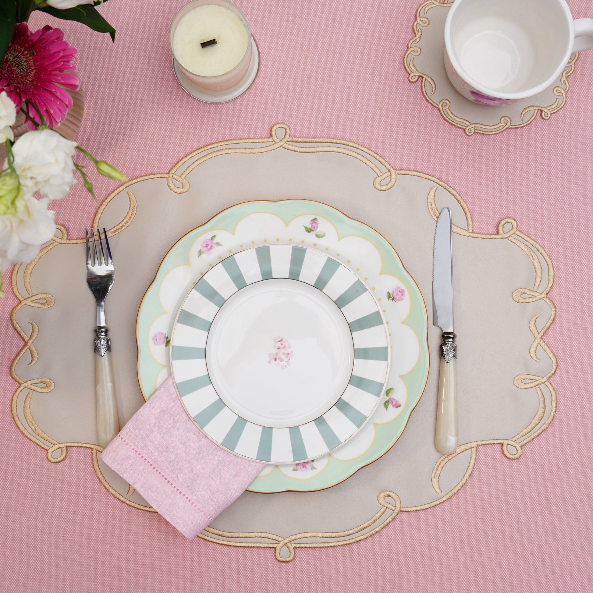 Handmade placemat and coaster set arranged for formal dining elegance