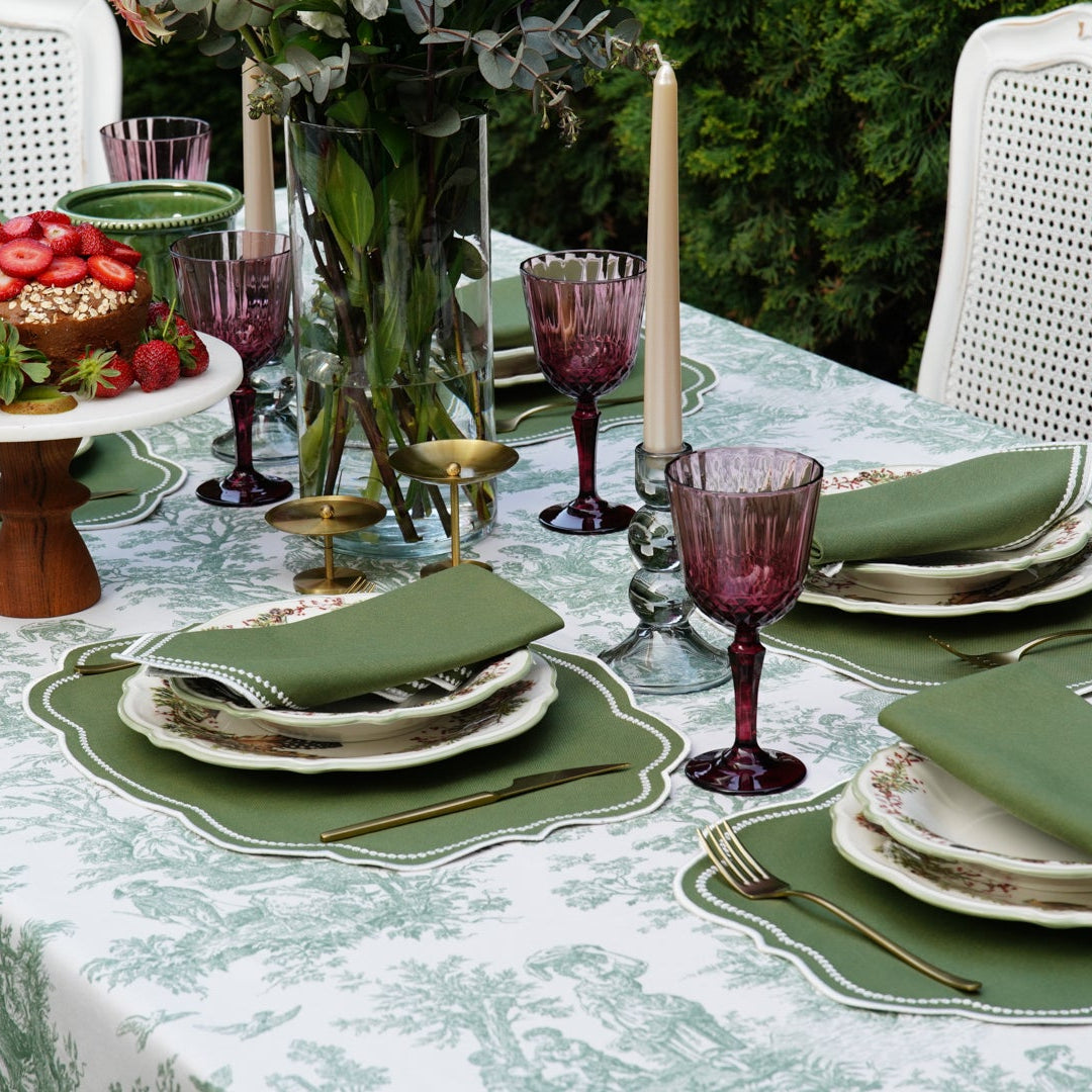 Full table view of a French-inspired green toile table linen, perfect for classic dining and elegant gatherings