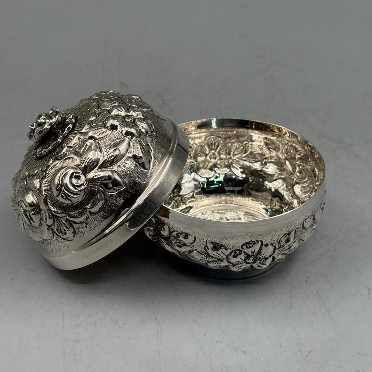 Handcrafted 900 sterling silver petite bonbonniere with embossed rose motifs shown open, made in Istanbul Grand Bazaar.