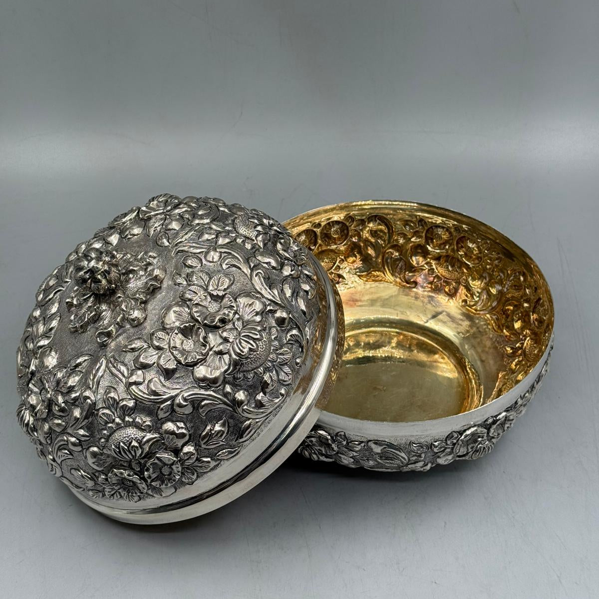 Hand-engraved 900 sterling silver floral bonbonniere shown open to reveal the luxurious gold-wash interior, handcrafted in Istanbul Grand Bazaar.