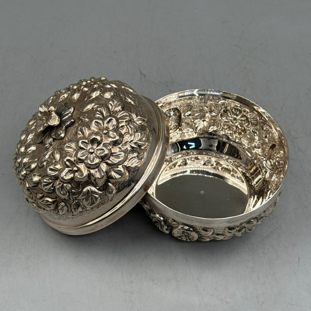 Handcrafted 900 sterling silver petite bonbonniere with floral relief motifs shown open, made in Istanbul Grand Bazaar.