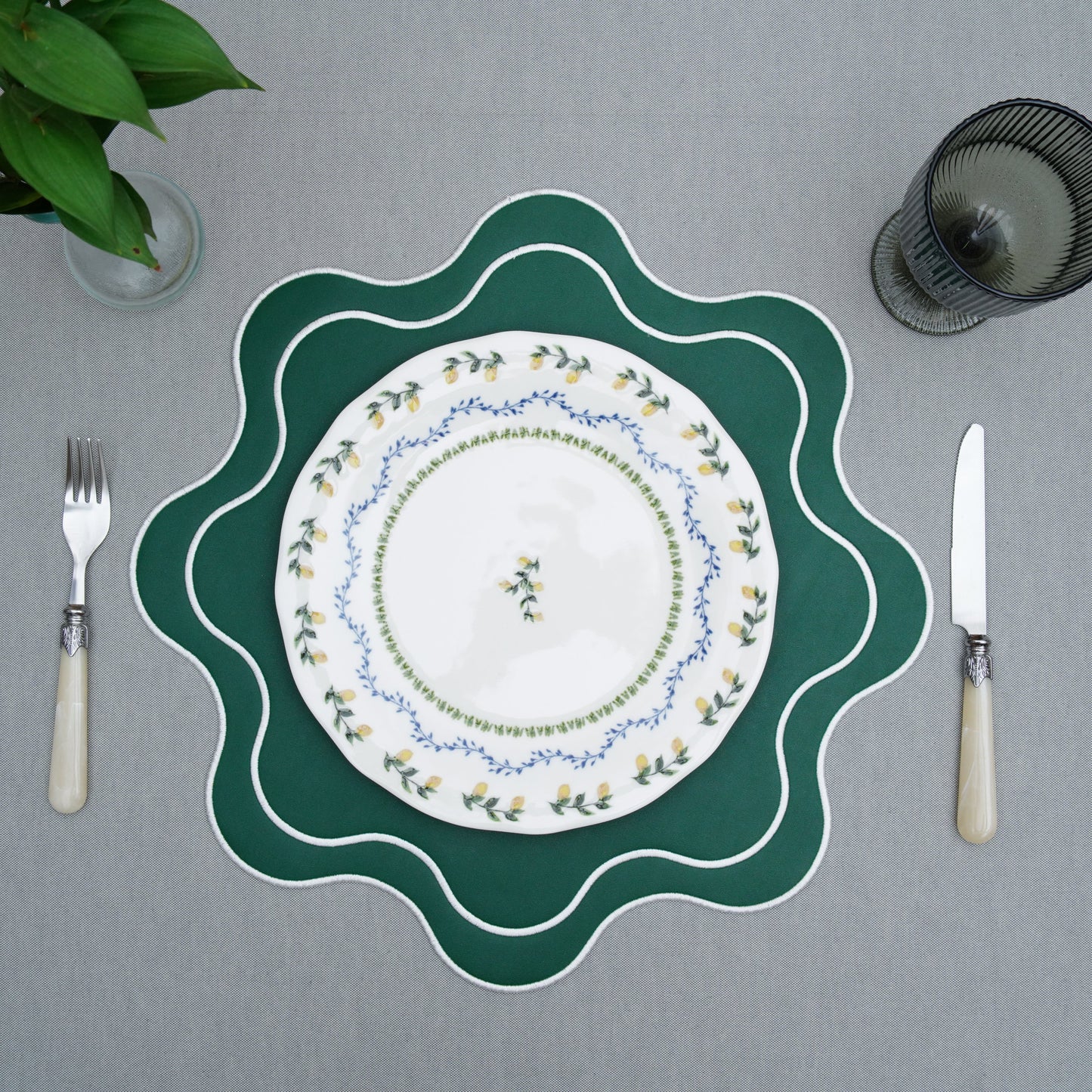 Close-up of the gray tablecloth fabric showing a subtle woven texture and clean, minimal look
