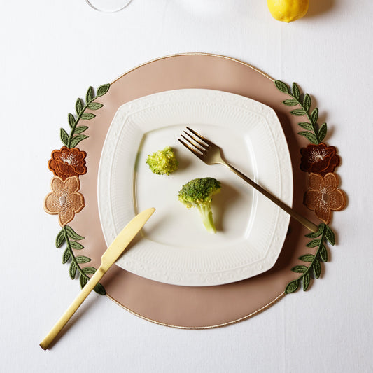 Jasmine Beige Round Faux Leather Placemat – perfect for weddings, formal dining, or special events — a luxury placemat made from eco-conscious vegan leather. Exclusively by PNR Decor.