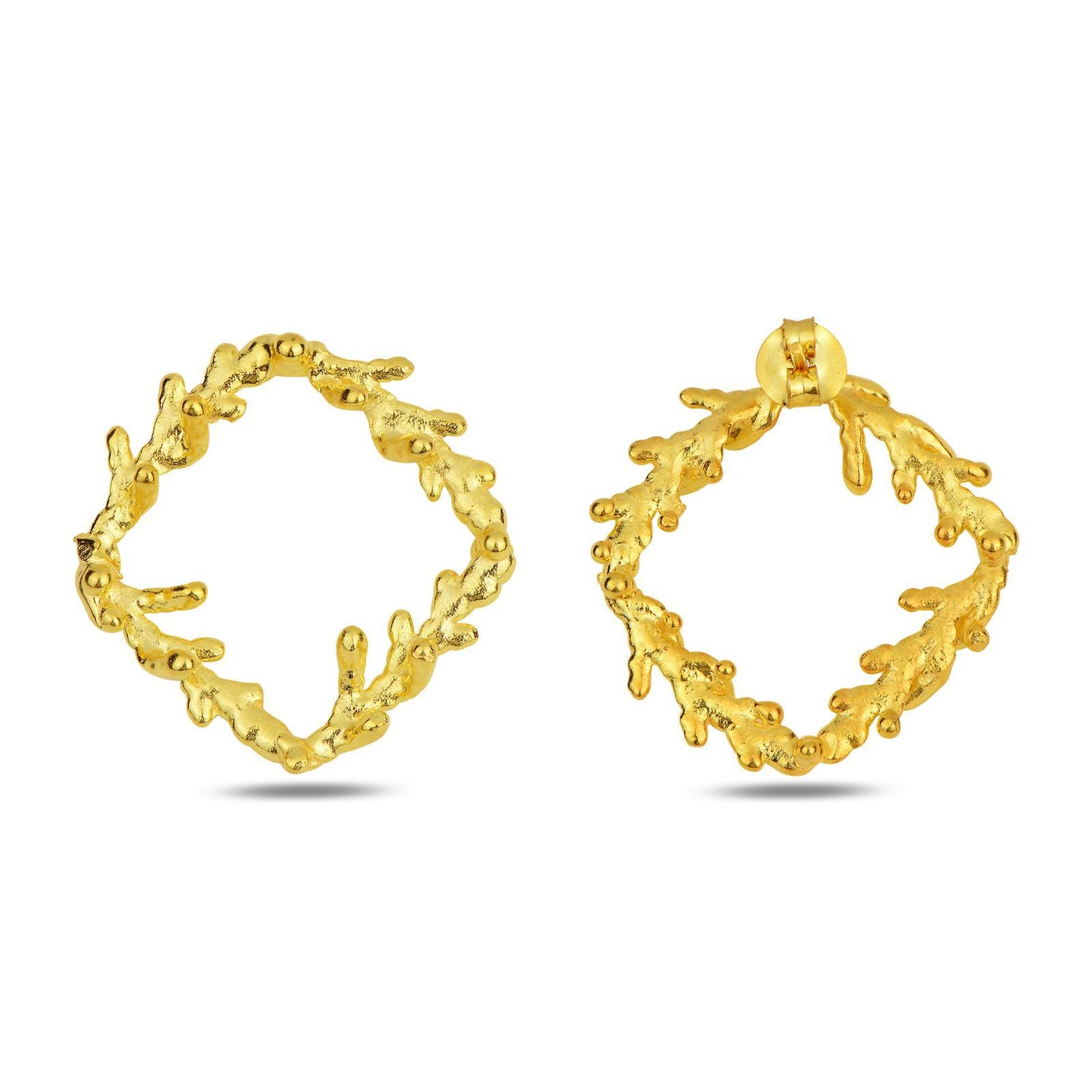 Close-up view of the detailed organic texture of the gold-plated silver pine branch square stud earrings. The surface showcases the intricate knots and grain of real nature casting, creating a complex, textured pattern.