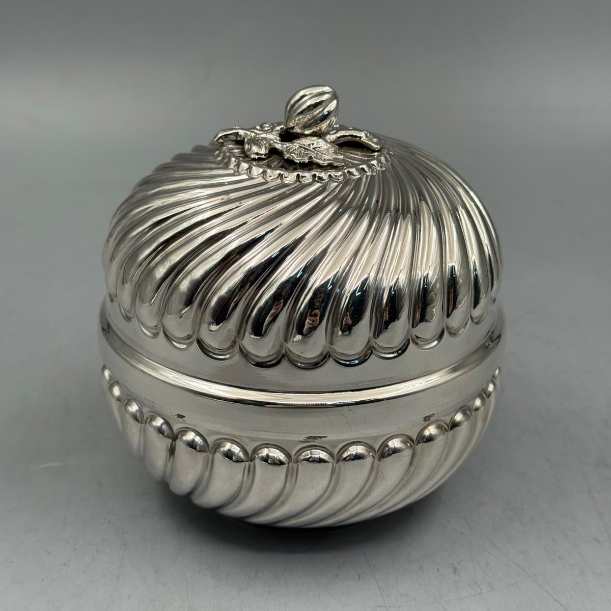 Front view of a 272g solid silver candy dish featuring a swirled ribbed design and a detailed bud finial handle.