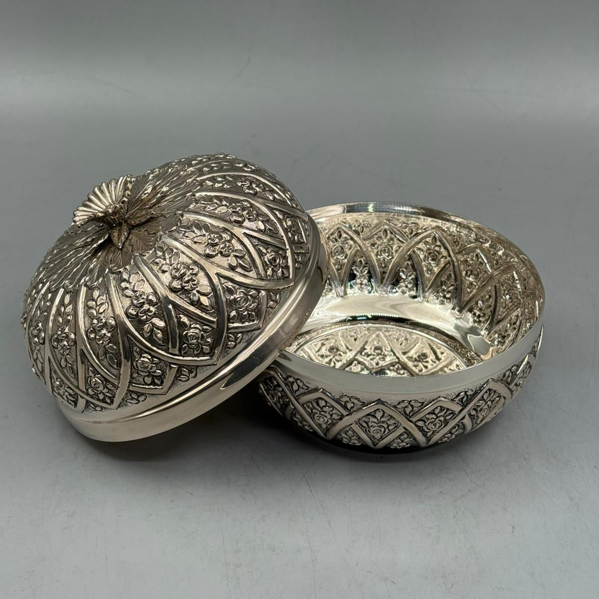Interior view of the 630g solid silver bonbonniere showing the high-polish finish and the continuation of the ribbed design inside.