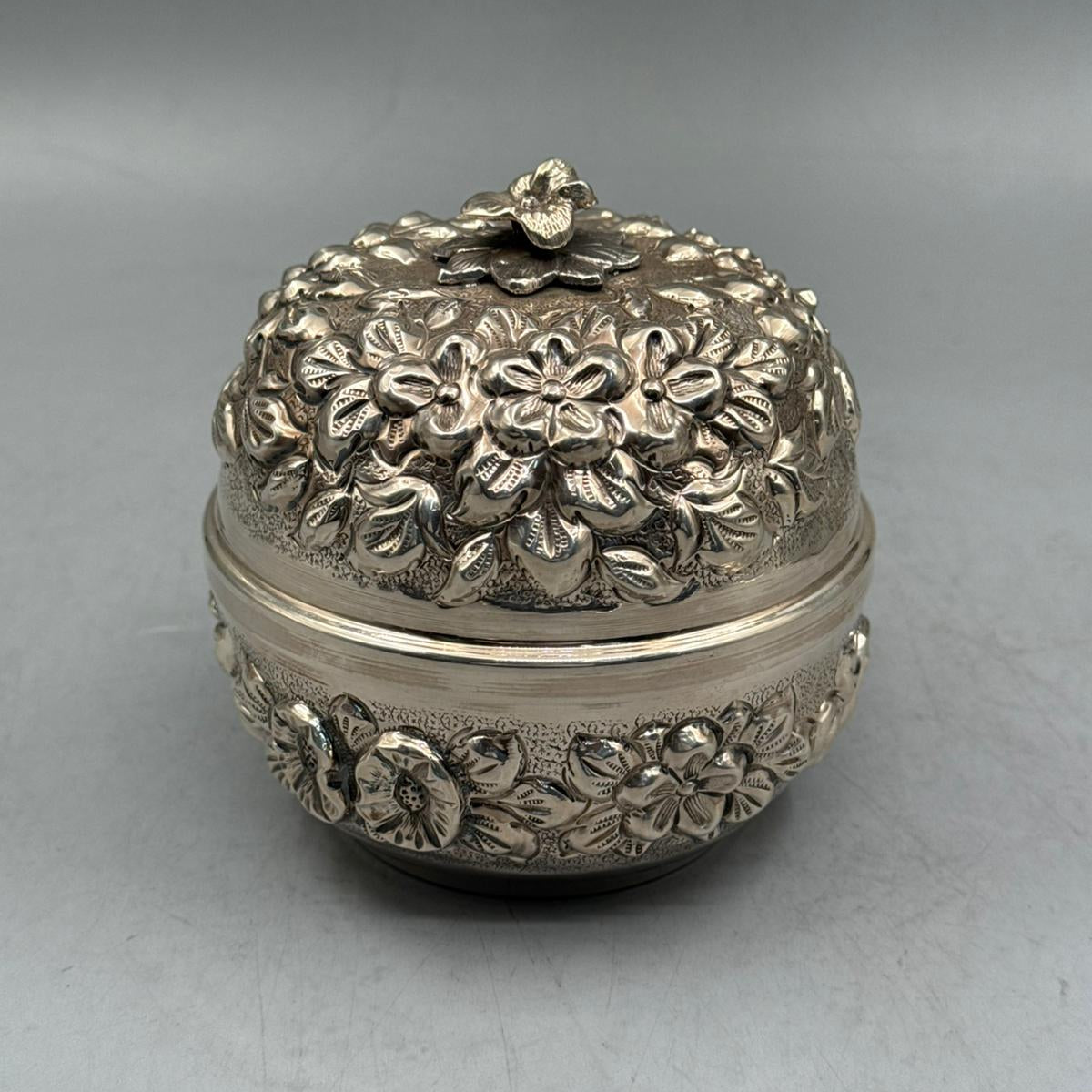 Front view of a 344g solid silver petite candy dish featuring high-relief embossed flowers and a detailed blossom finial handle.