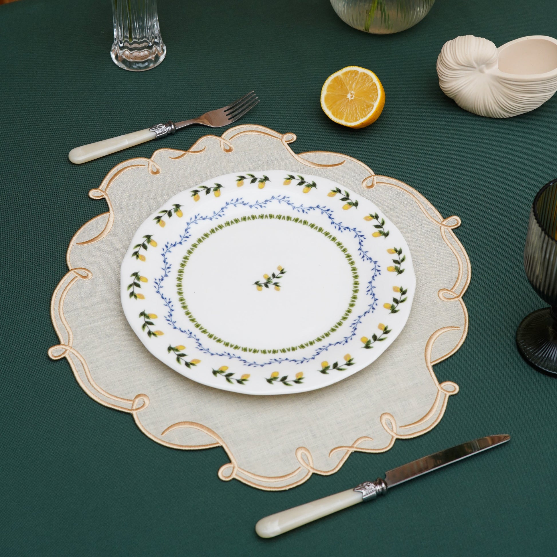Hand-sewn ivory placemat with golden trim ideal for weddings