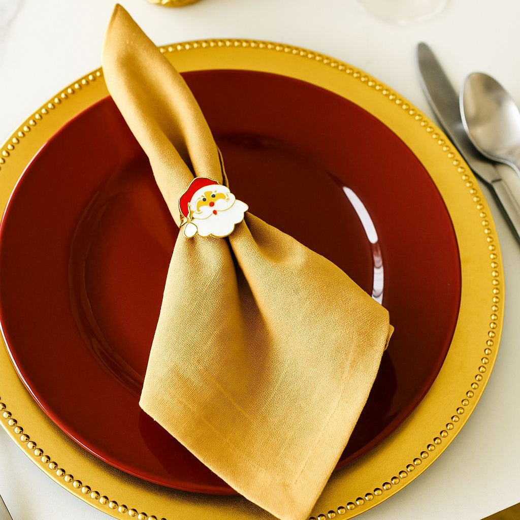 Front view of jolly Santa Claus enamel napkin ring with a cheerful smiling face and traditional red hat.