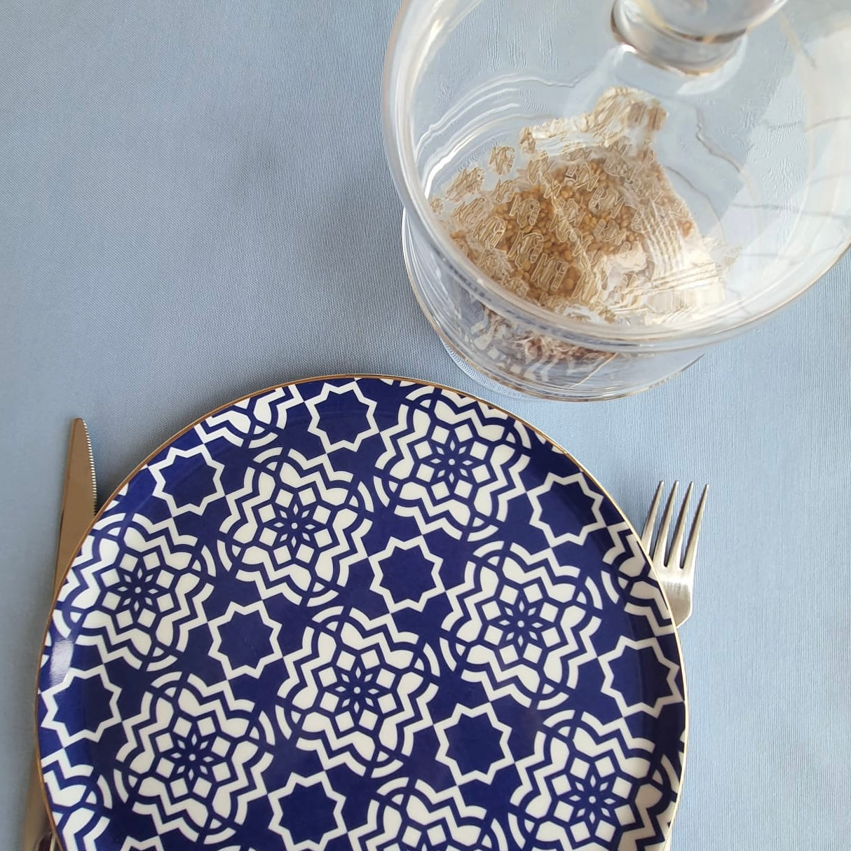 Full table view of a light blue rectangular tablecloth for everyday dining and event styling