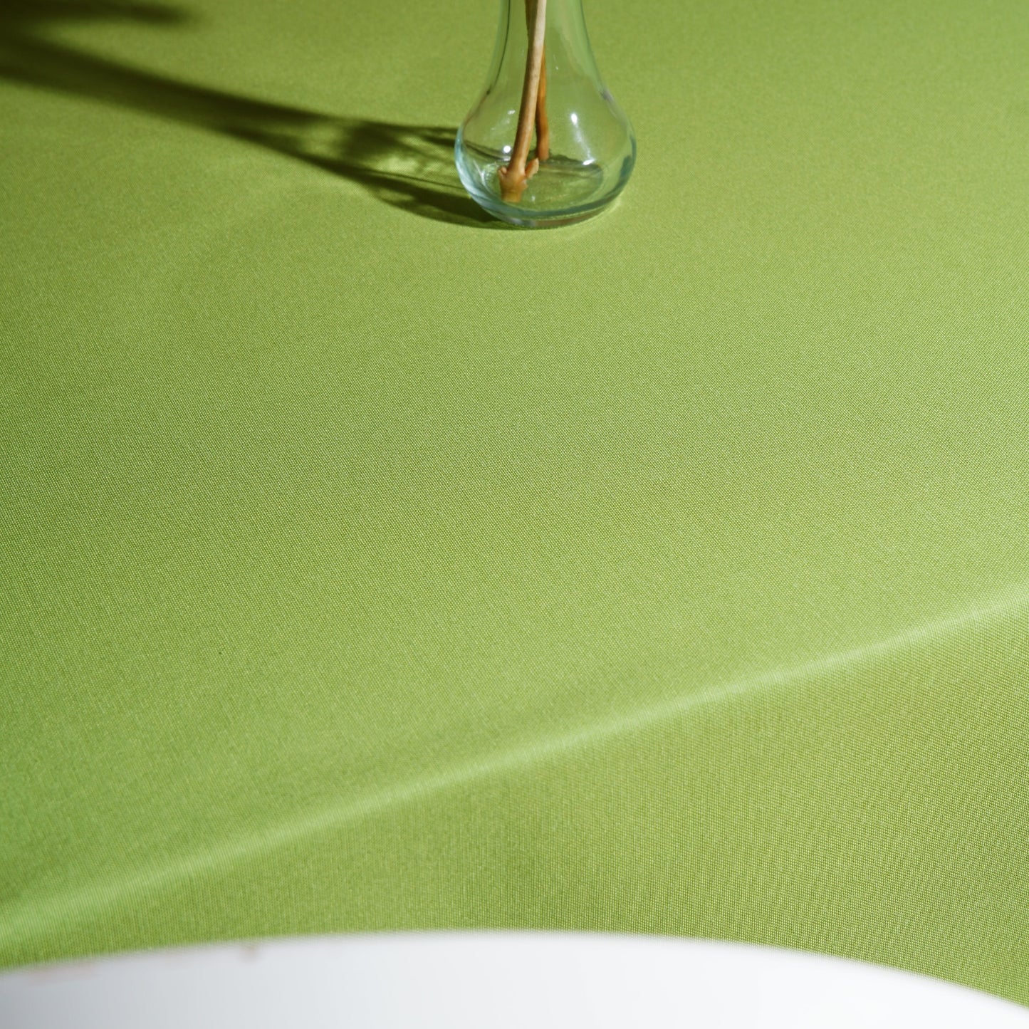 Full table view of a light green rectangular tablecloth for everyday dining, garden parties, and events