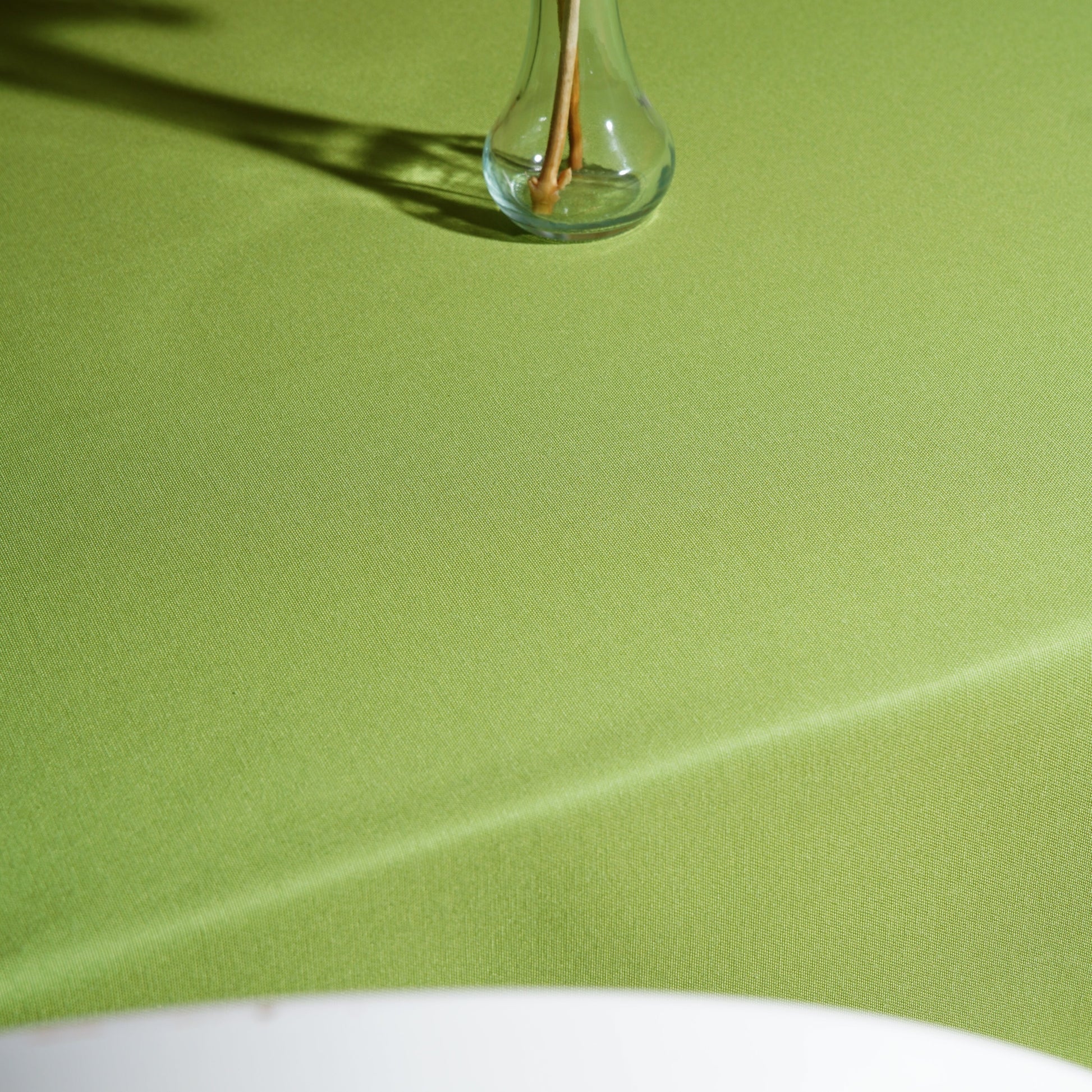 Full table view of a light green rectangular tablecloth for everyday dining, garden parties, and events