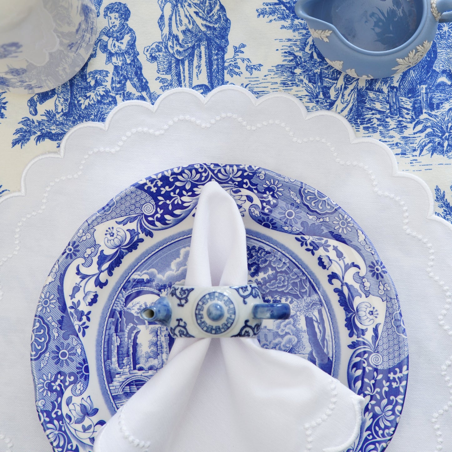 High-quality spring table linens showcasing the detail of the Lily White handmade embroidered set