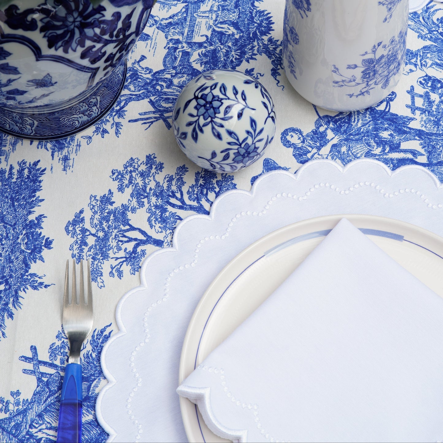 Spring breakfast table setting ideas with the elegant white scalloped edge placemat and matching napkin