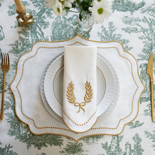 Luxury handmade embroidered cotton placemat made with sustainable cotton, adds charm to holiday and event tables, custom-made and ships from the USA.