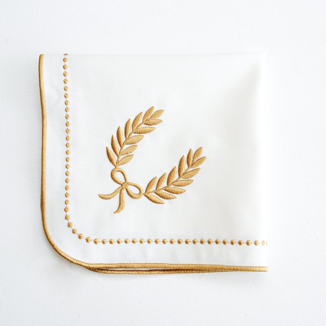 Luxury handmade embroidered cotton placemat made with sustainable cotton, adds charm to holiday and event tables, custom-made and ships from the USA.