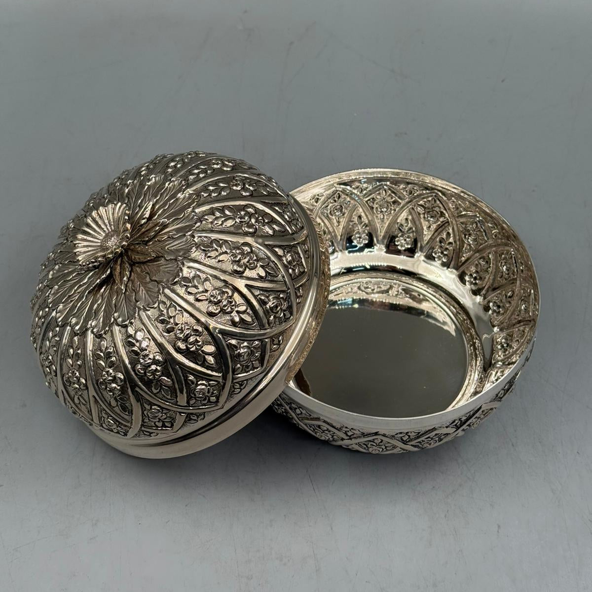 Handcrafted 900 silver rose inlaid bonbonniere as a luxury statement piece for high-end home decor and collections.