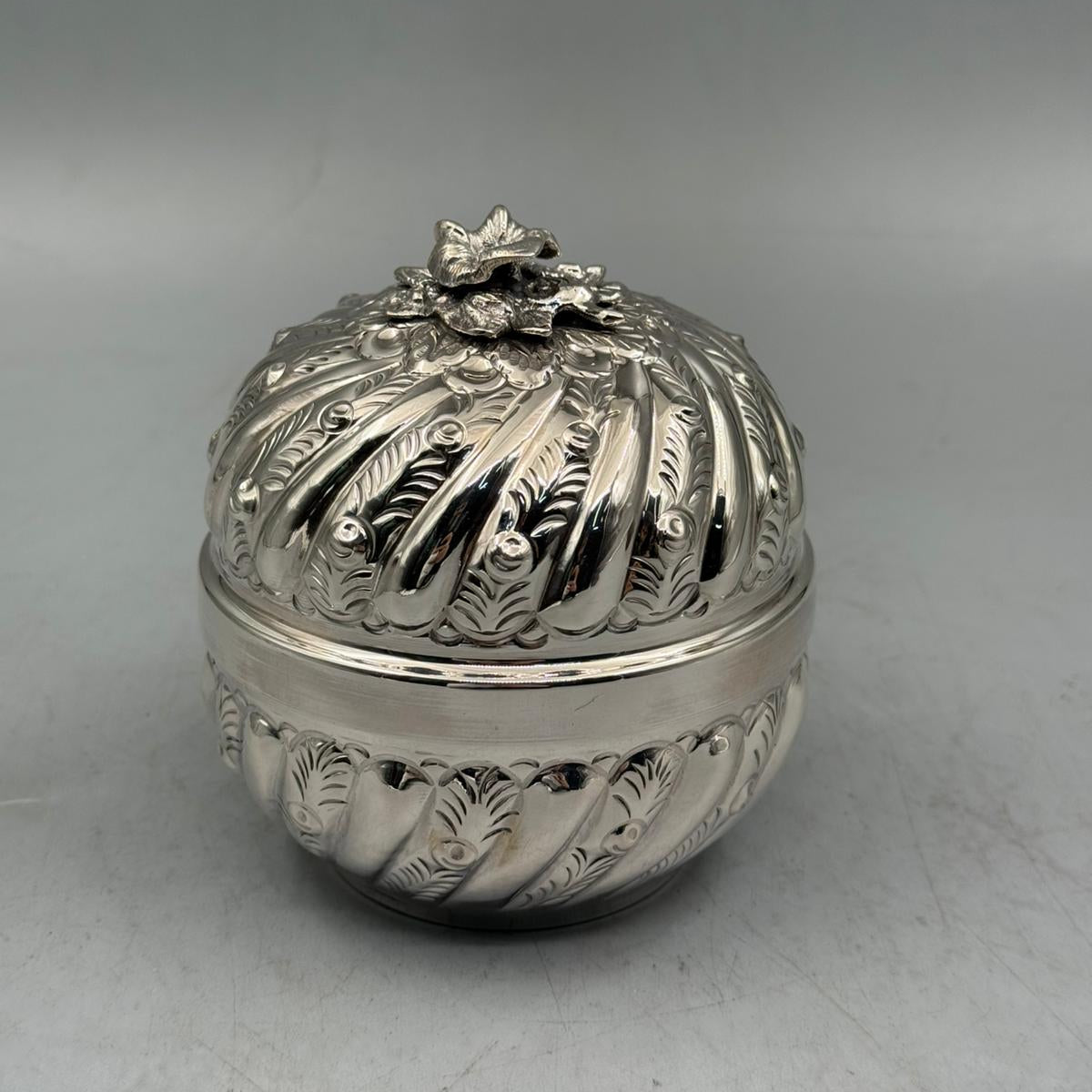 Full profile of the 10cm diameter row-inlaid silver bonbonniere, a premium statement piece for luxury home decor.