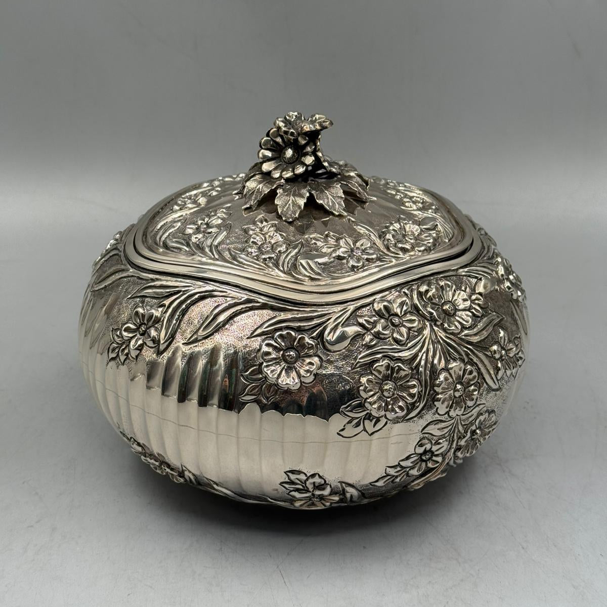 Side profile of the 21cm diameter floral silver bonbonniere, showcasing the elegant domed shape and traditional patterns.