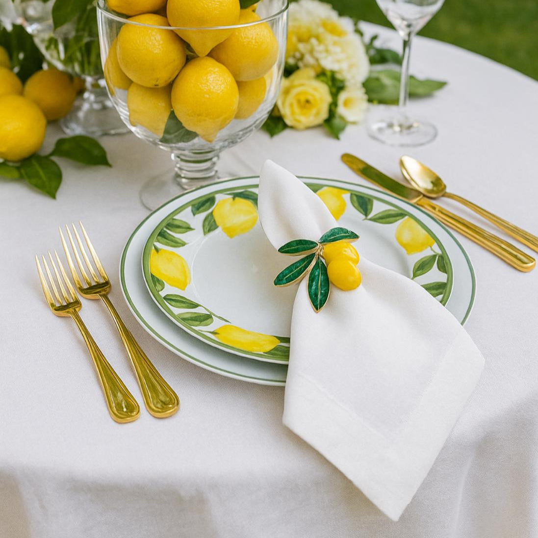 Front view of Mediterranean lemon grove enamel napkin ring with vibrant yellow fruit and green leaves.