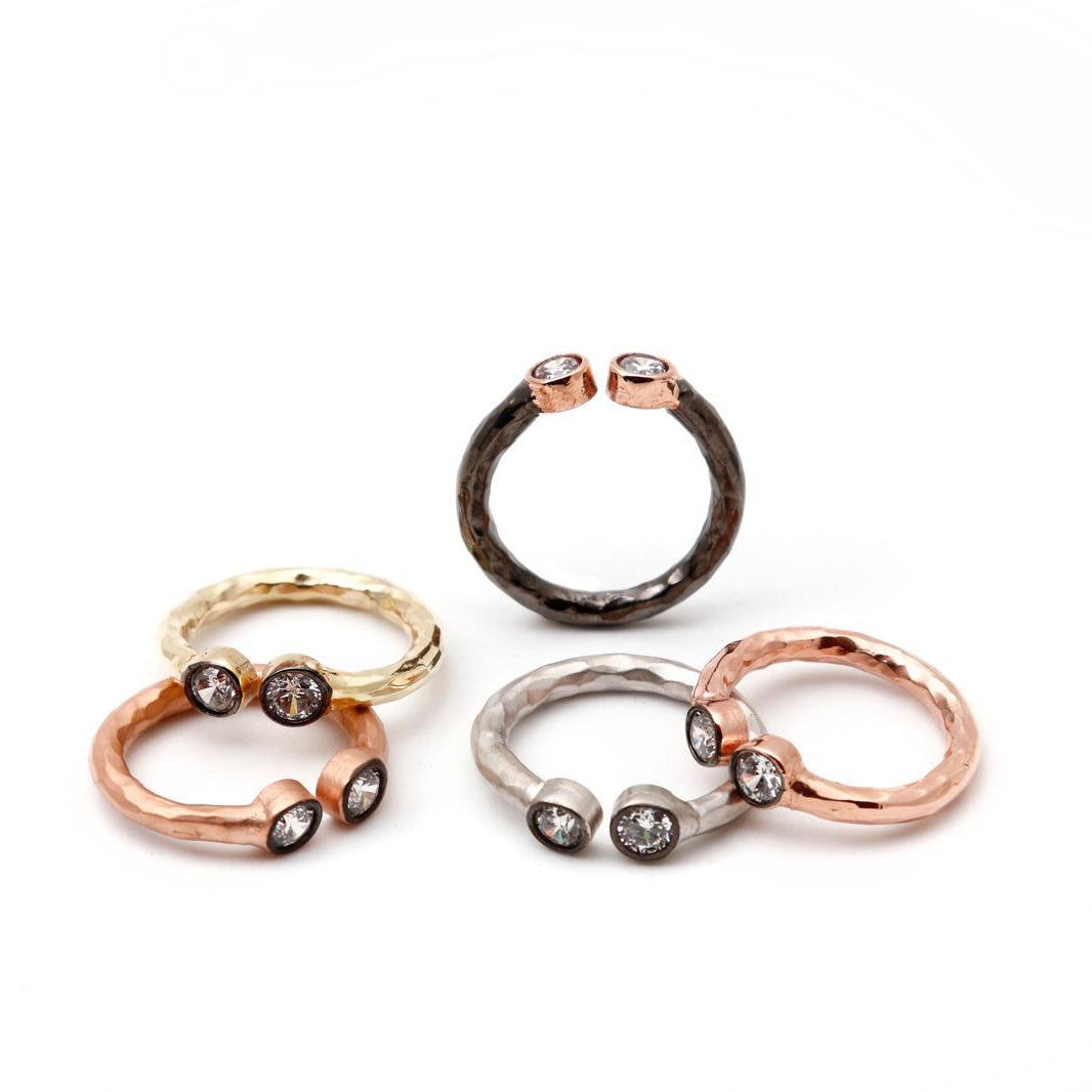 A beautiful stack of nature-inspired textured band rings crafted from authentic pure silver. The open design and multi-color platings offer versatile everyday styling.