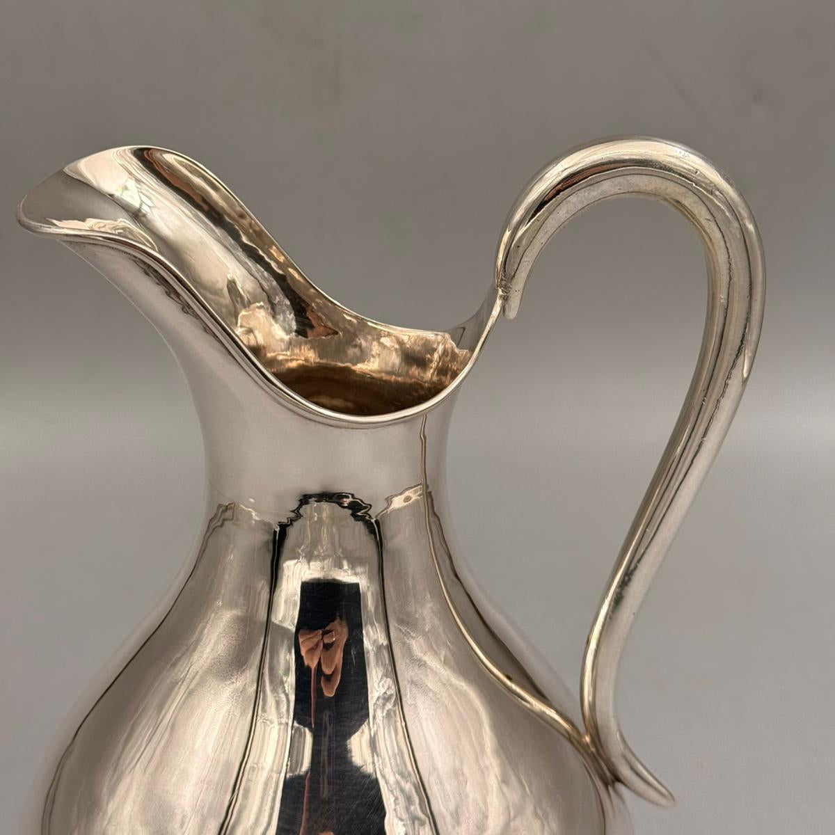 Side profile of elegant plain silver water jug with high handle by PNR Decor ship from USA