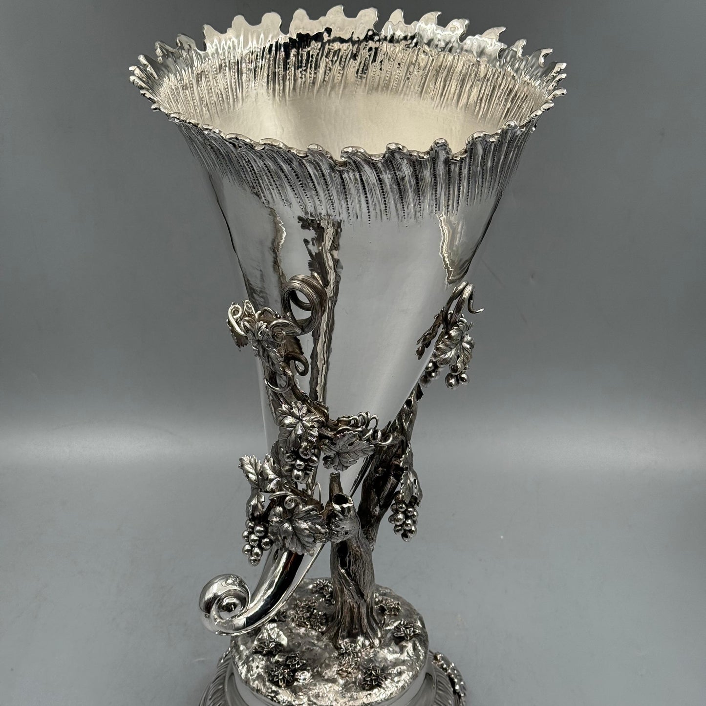 Detailed view of cast silver grape bunches and vine leaves on vase by PNR Decor ship from USA