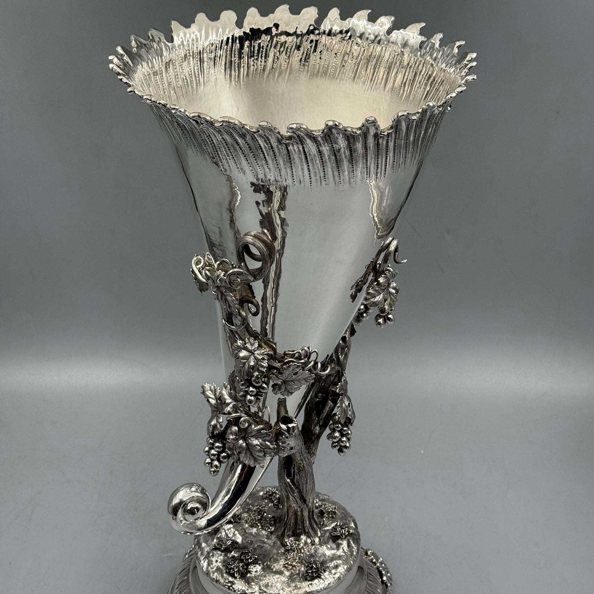 Detailed view of cast silver grape bunches and vine leaves on vase by PNR Decor ship from USA