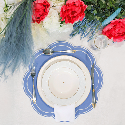 Nurture Light Blue Round Faux Leather Placemat – expertly handcrafted from eco-friendly, vegan faux leather with elegant embroidery and double-layered design, stain-resistant and durable. Exclusively by PNR Decor.