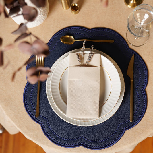 Nurture Navy Blue Round Faux Leather Placemat  – expertly handcrafted from eco-friendly, vegan faux leather with elegant embroidery and double-layered design, stain-resistant and durable. Exclusively by PNR Decor.