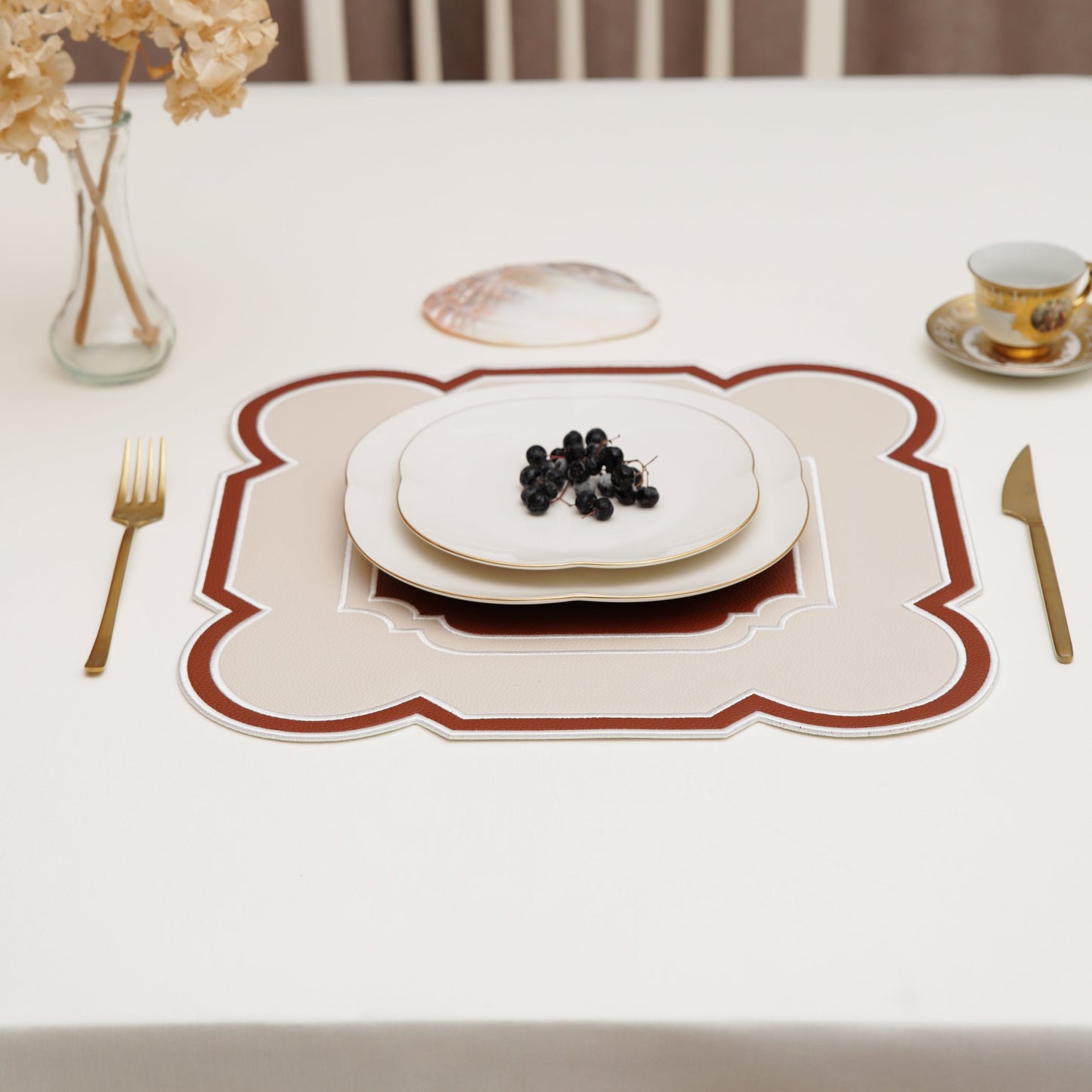 Off-white rectangular tablecloth surface photographed in soft light to highlight the weave