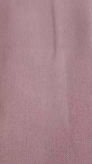 Close-up of the blush pink table linen showing a subtle woven texture and smooth solid finish