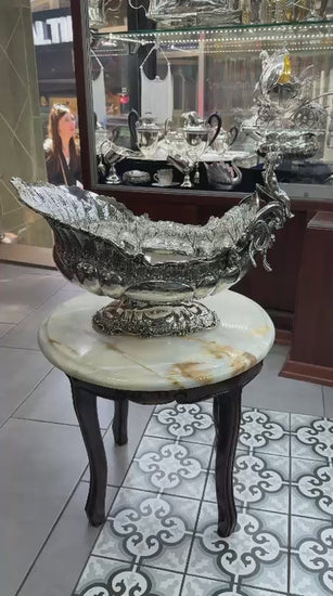 Antique silver gondola centerpiece video showcasing ornate Rococo details, cherub figurine close-up, and full 360° view for collectors and home decor lovers.