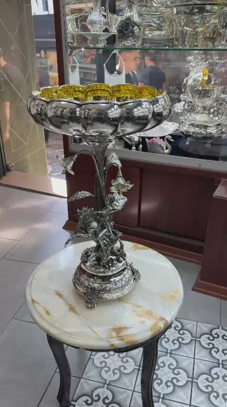 Antique silver centerpiece video featuring detailed horse rider figure, gilded floral bowl, and full 360° decorative view.