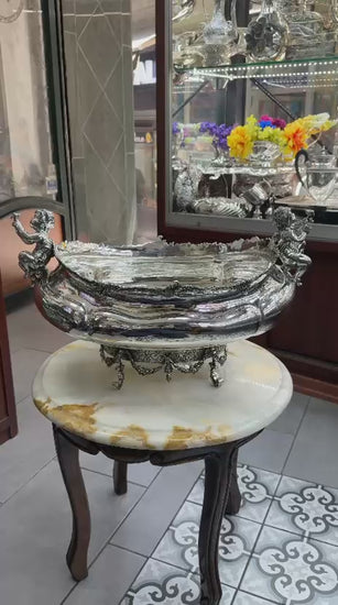 Antique silver gondola bowl video highlighting cherub figures, ornate floral base, and detailed Rococo craftsmanship in 360° view.
