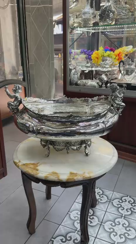 Antique silver gondola bowl video highlighting cherub figures, ornate floral base, and detailed Rococo craftsmanship in 360° view.