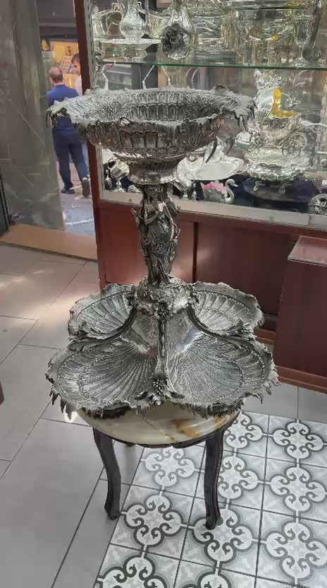 Antique silver shell form centerpiece video highlighting classical female figures, ornate Rococo details, and full 360° decorative view.