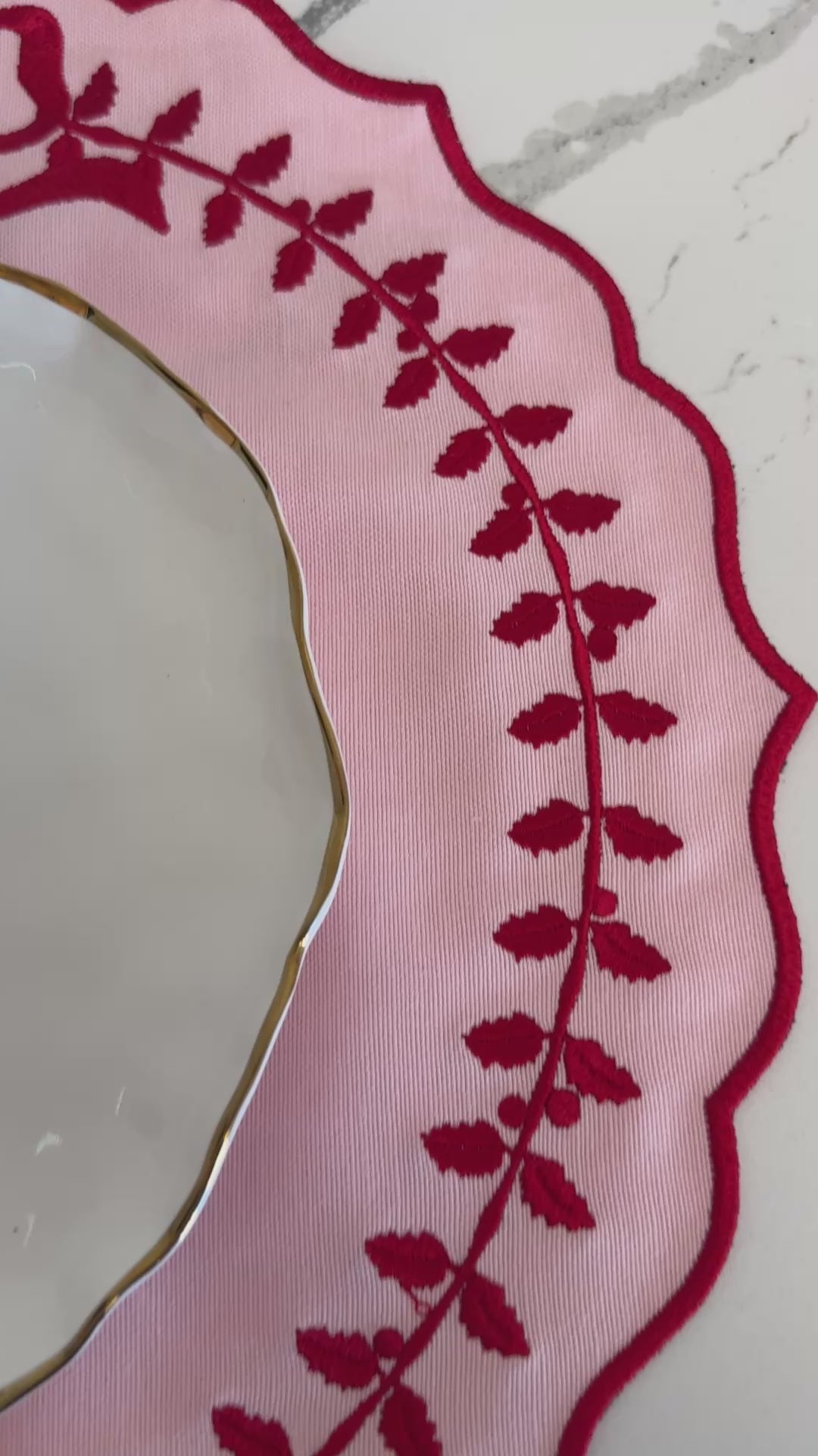 A short video showcasing the Champagne Pink Cotton Blend Round Placemat in use — close-up views of the embroidered scalloped edges, waterproof surface, and elegant texture on a modern dining table setup.