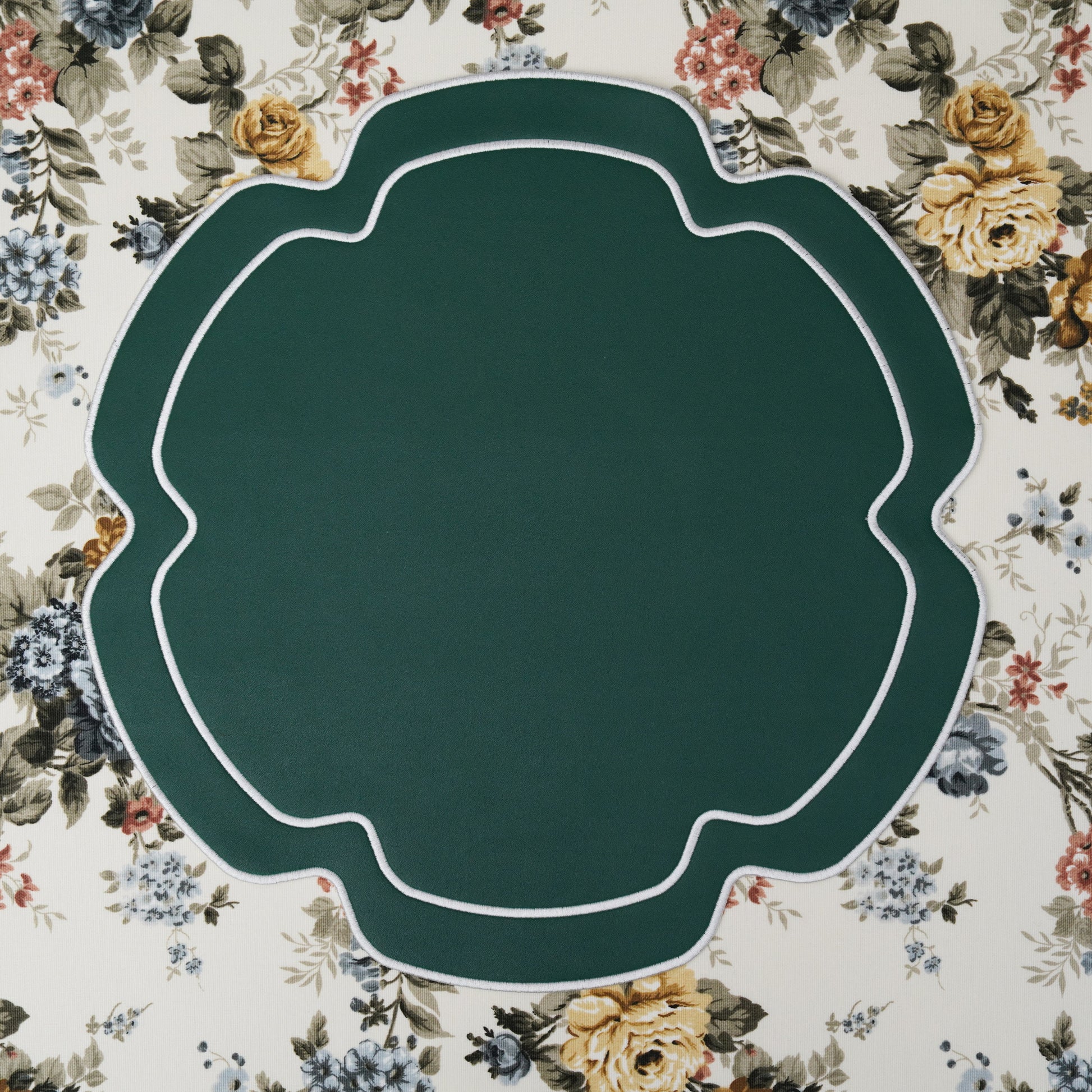 Smooth-surfaced placemat with delicate edging on formal table