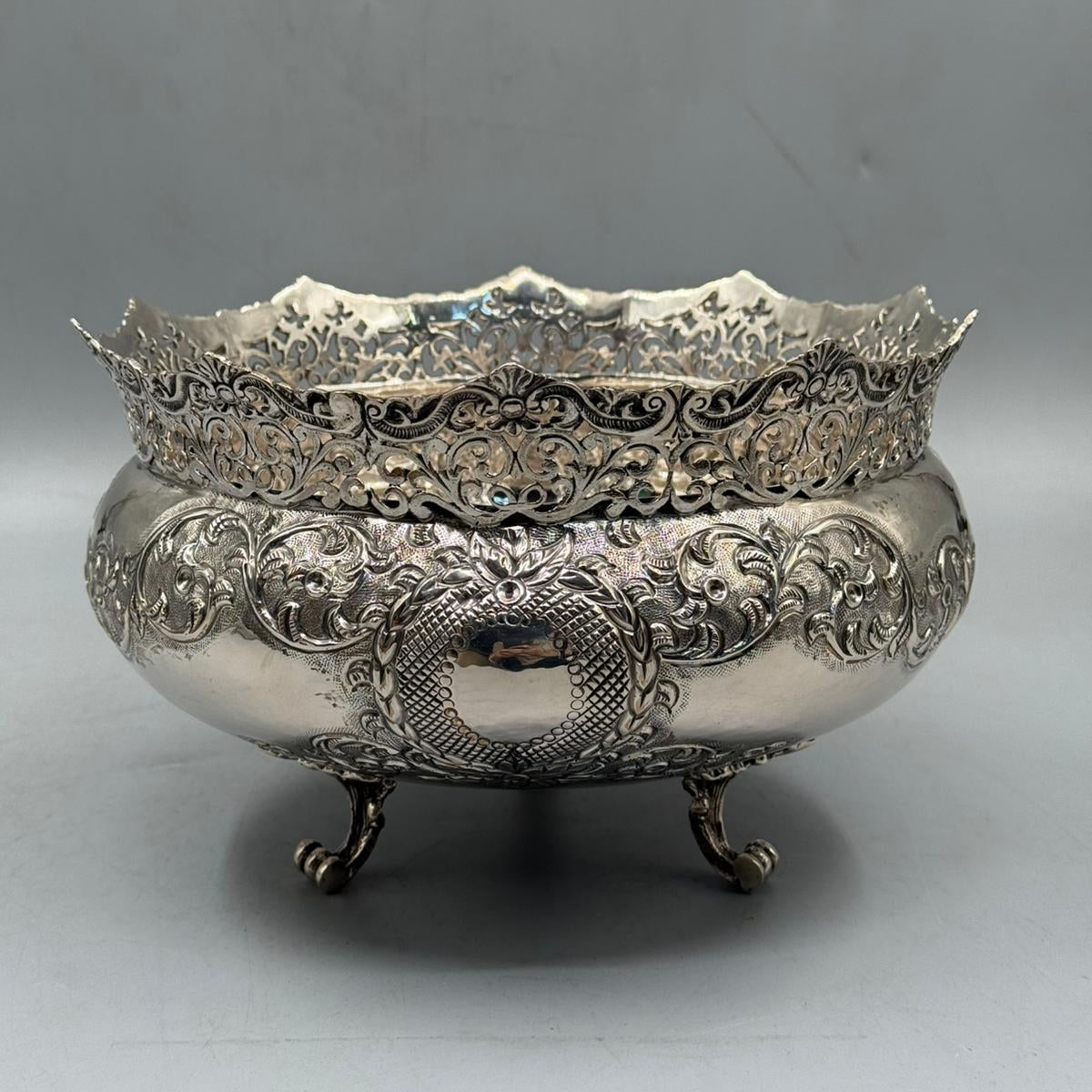Close up of reticulated openwork rim and floral relief on silver bowl by PNR Decor ship from USA