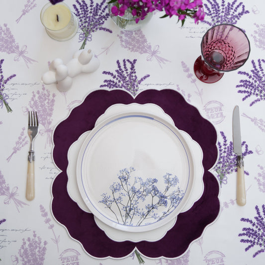 Faux leather placemat with velvet detail arranged on a formal dining table